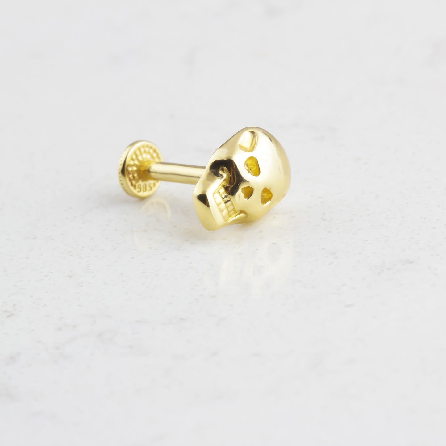 SKULL TRAGUS PIERCING